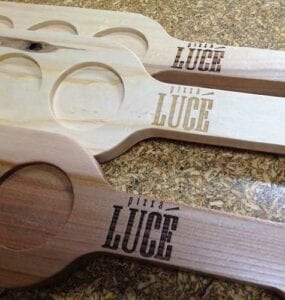 Pizza Luce - Community Table, Wood Block Cladding, Business Promotional Flight Paddles